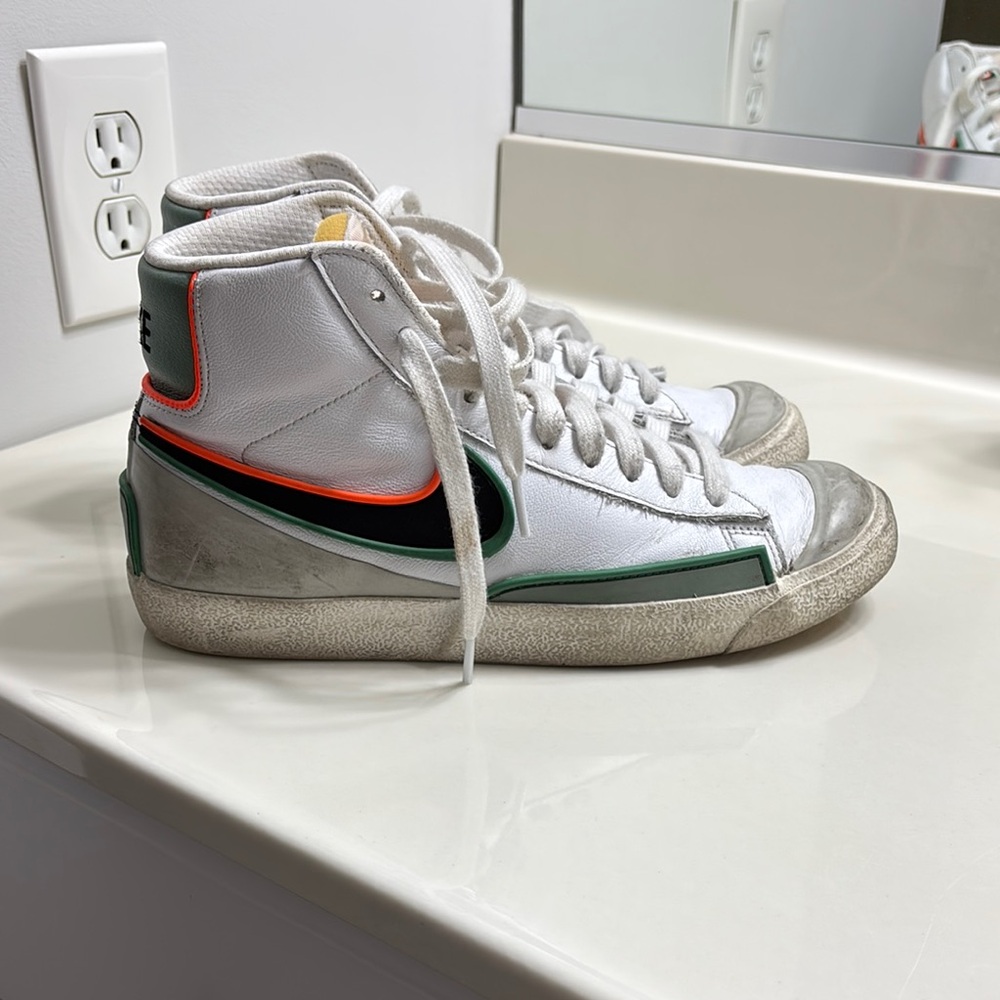 White, Orange, blue/green high top Nike Balzers, size 8 in women’s.